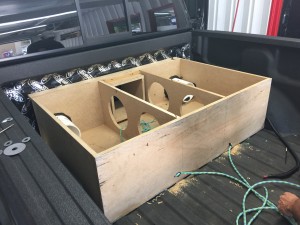 Sixth Order ban pass box installed and ported through the bed of the Next Level Edition Raptor ready to be fitted with Mmats Pro Audio.