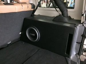 Custom Ported hideaway enclosure that houses a Mmats Monster 10 subwoofer.