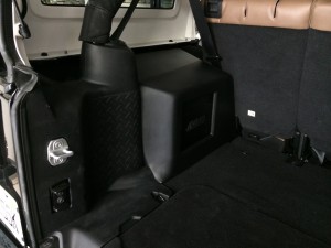Custom trim panel for the Mmats amplifier that powers the subwoofer.