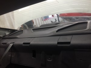 Custom ported rear deck wrapped in vinyl to go with the factory theme.