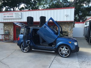 Honda Element Mobile Dj vehicle setup infront of the shop ready for a concert.