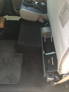 Pioneer shallow mount subwoofer with custom down fire enclosure installed in a 2015 Ford F-150.