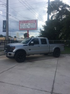 Fuel rims, Toyo Tires, custom paint, Rigid LED bars, and Recon headlights installed on a 2012 Ford F-250.