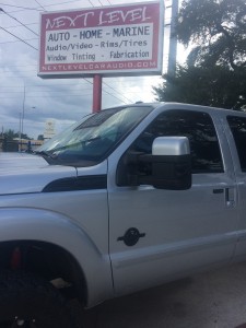 Custom rhino lined and painted emblems and mirrors on a 2012 Ford F-250.