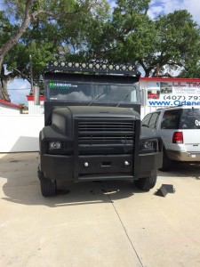 Matte black dip, Custom bumper and light bar on armored truck limo