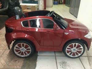 Custom BMW x6 minicar with new upholstery, paint and Kicker Audio.