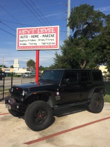 2015 Jeep Wrangler Unlimited with 4" Rough Country suspension lift.
