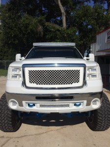 2008 GMC Sierra 2500 with full custom molded Rigid Headlights and bumper shroud.