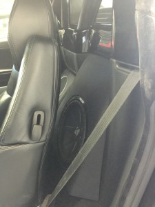 Custom enclosure behind drivers seat in Ferrari 360 Spyder.