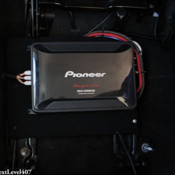 Pioneer Amplifier Installed Under Middle Row Seat