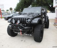 Black-Jeep-Next-Level-Inc-Custom-Install-RIGID-Morimoto-lights-Alpine-speakers-Full-Driver-Side-Front-Bump-Custom-Lighting-RIGID-Fox-Suspension-Profile